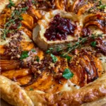 Golden Sweet Potato Tart with Brie, Caramelized Onion, Pecans & Cranberry Maple Glaze