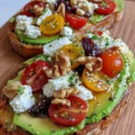 Avocado Toast with Feta, Cherry Tomatoes, Cranberries, and Walnuts