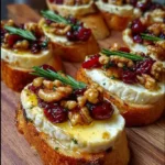 Warm Brie & Cranberry Walnut Crostini with Hot Honey