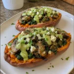 Loaded Sweet Potatoes with Garlic Mushrooms, Spinach, Feta & Creamy Avocado Sauce