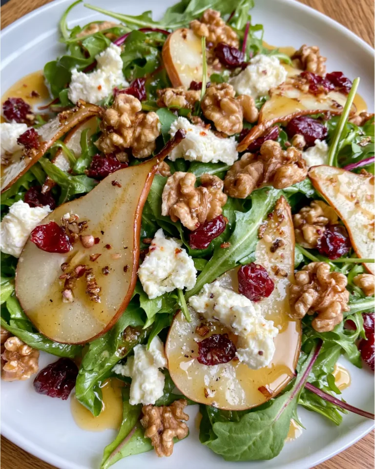 Pear, Rocket & Goat Cheese Salad with Toasted Walnuts, Cranberries & Maple Dijon Dressing