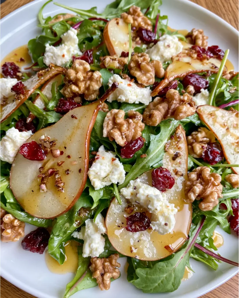 Pear, Rocket & Goat Cheese Salad with Toasted Walnuts, Cranberries & Maple Dijon Dressing