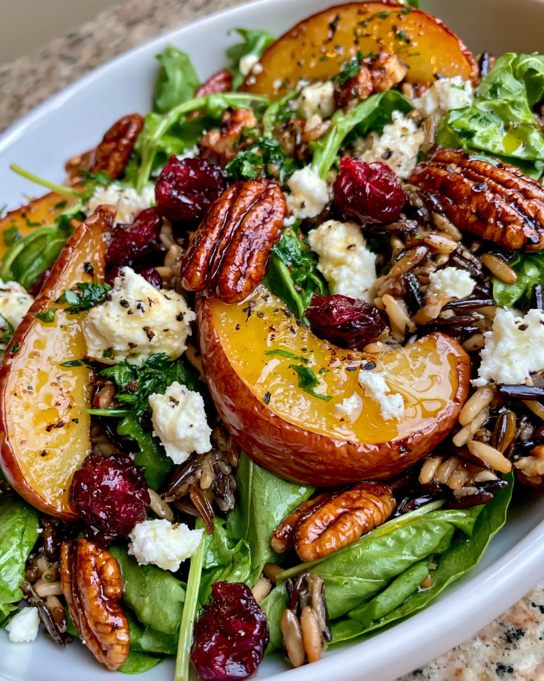 Warm Wild Rice Harvest Salad with Roasted Pears, Cranberries, Feta & Candied Pecans