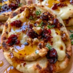 Mini Naan with Brie, Cranberries & Toasted Walnuts with a Hot Honey Drizzle
